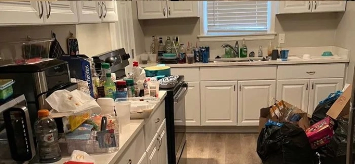 Messy kitchen with dirty countertops before Espoo cleaning service